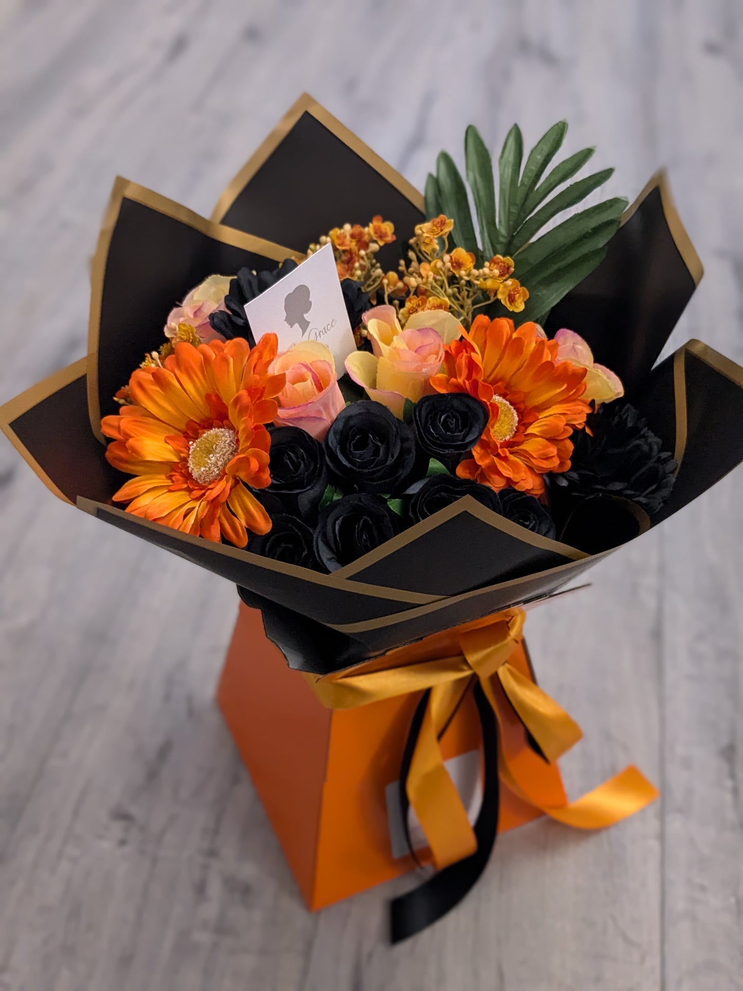 Orange & Black Stunning Handtied Bouquet