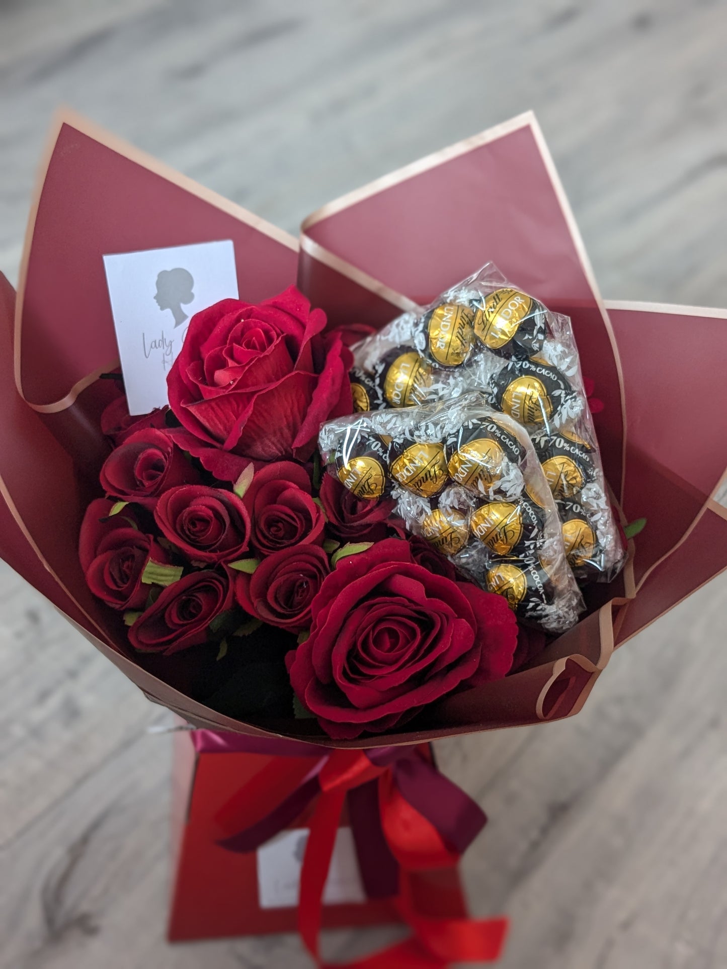 Red Dark Lindt Stunning Handtied Bouquet