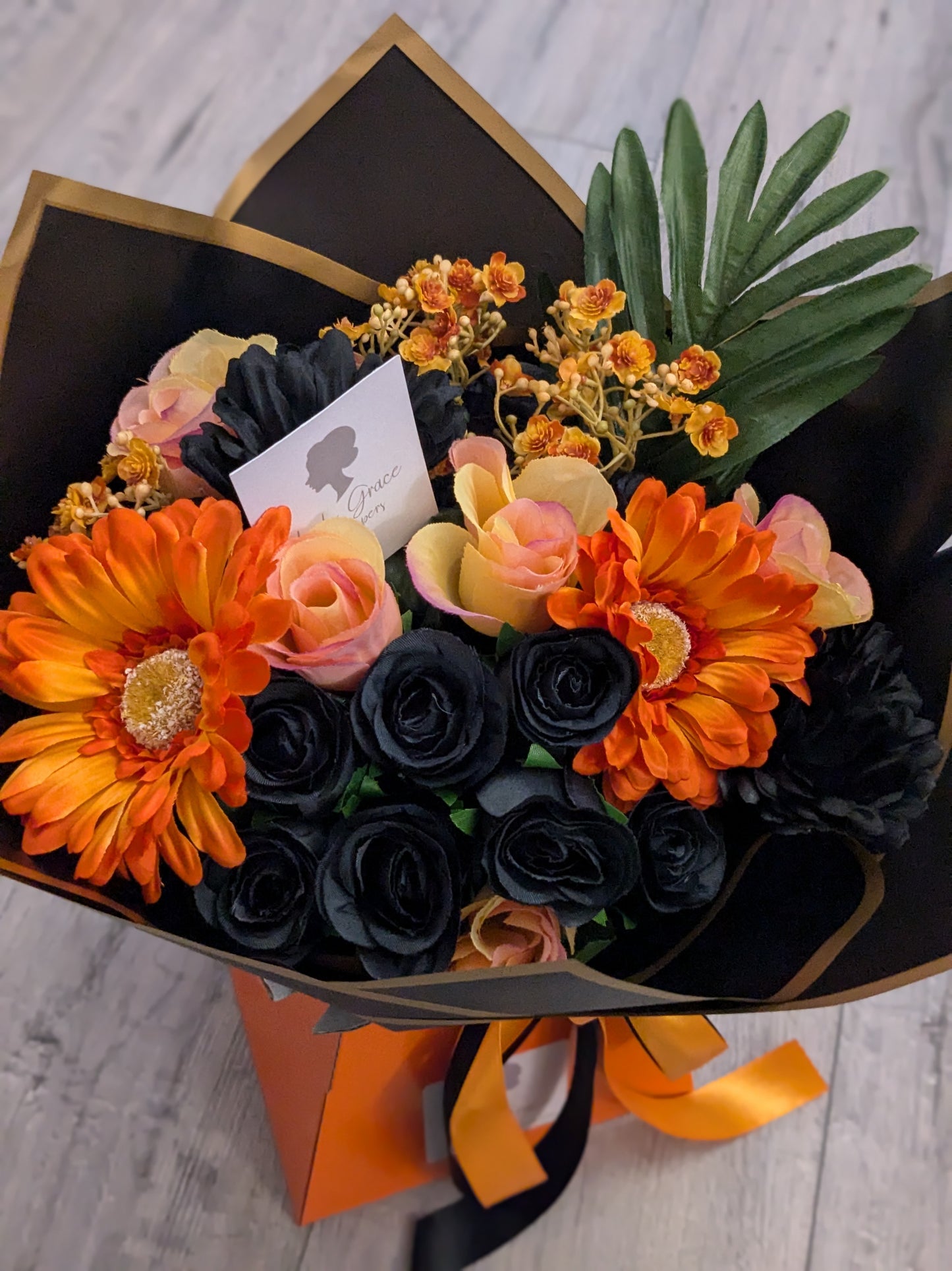 Orange & Black Stunning Handtied Bouquet