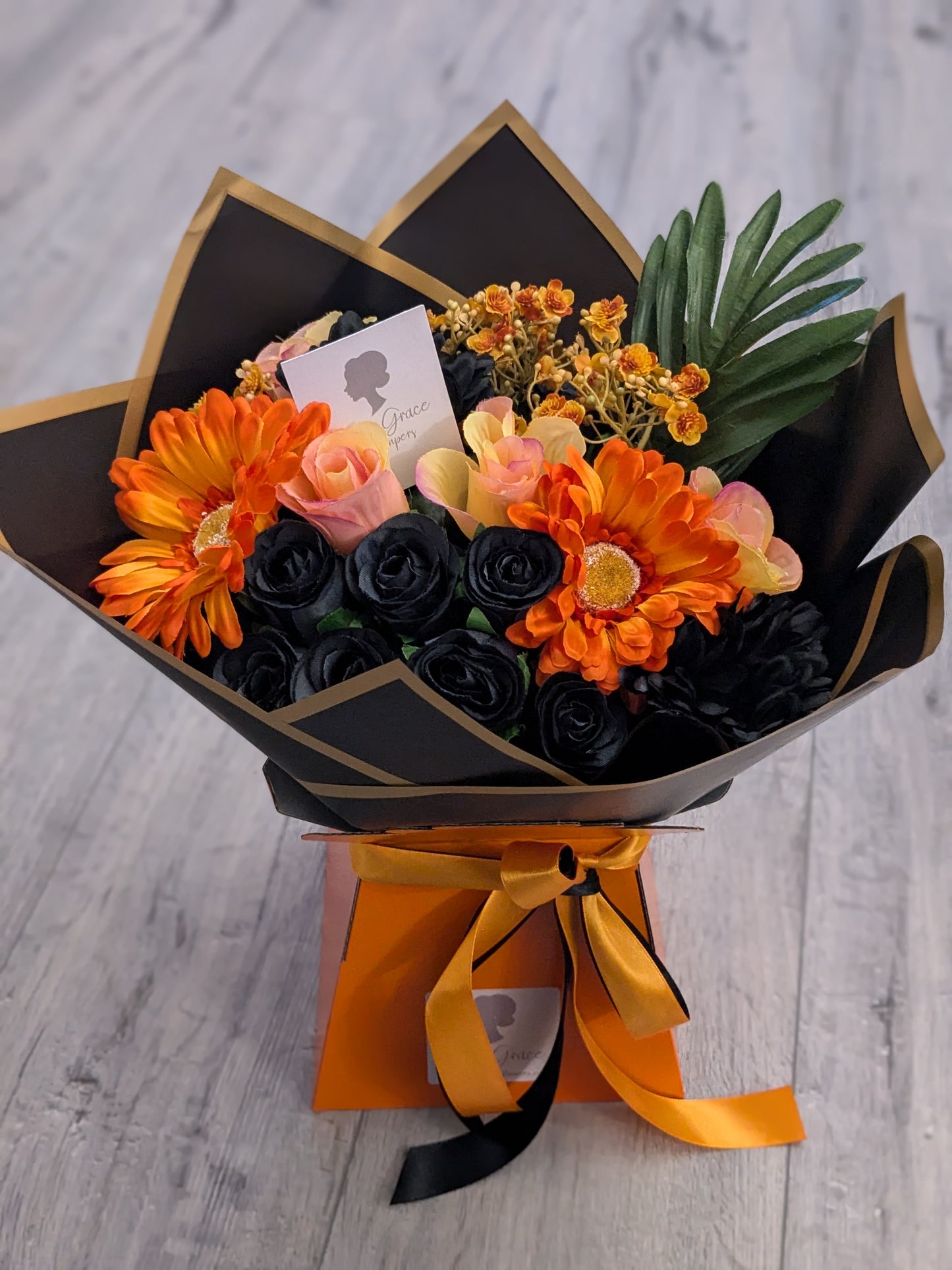 Orange & Black Stunning Handtied Bouquet