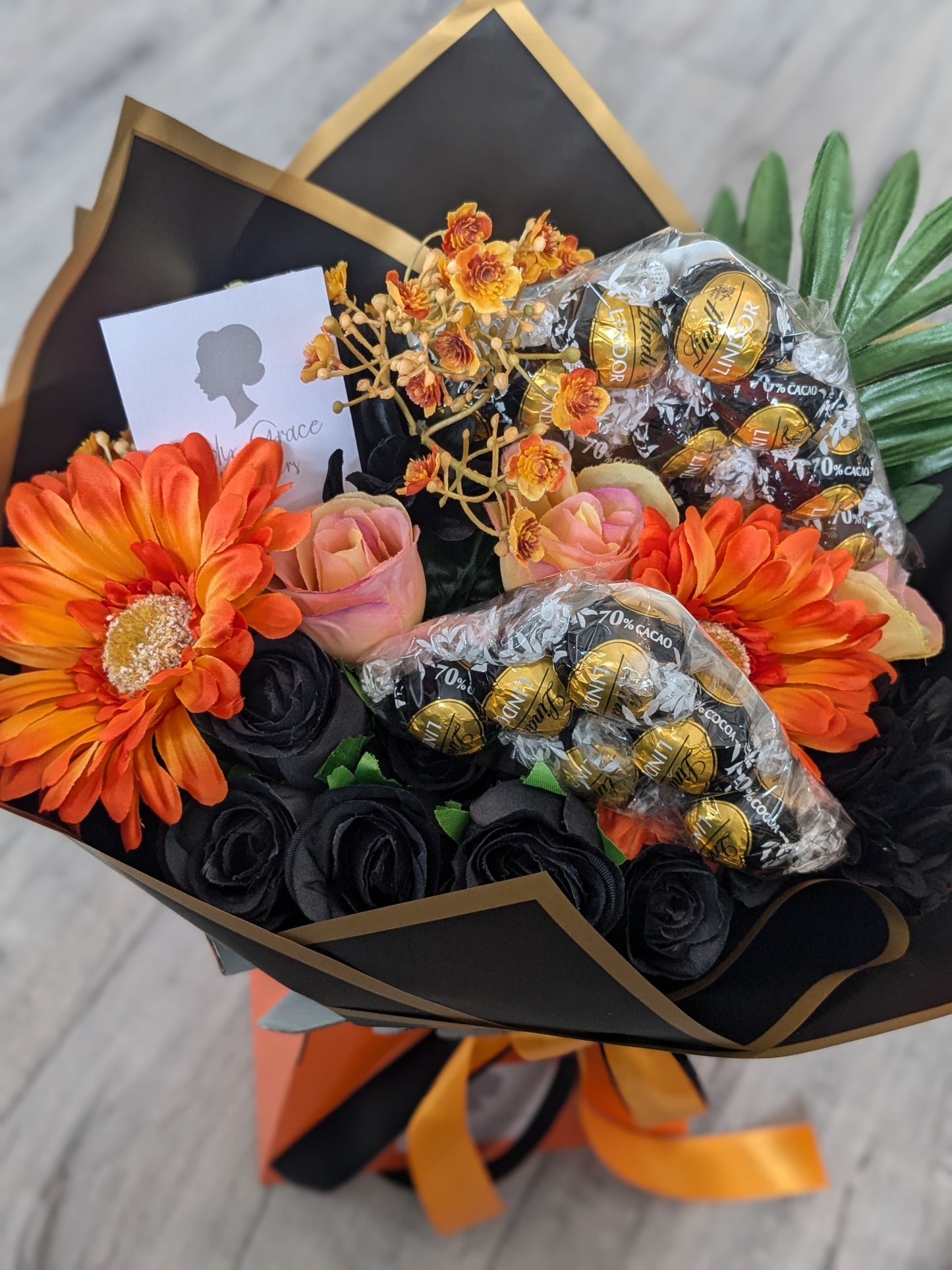 Orange & Black Dark Lindt Stunning Handtied Bouquet