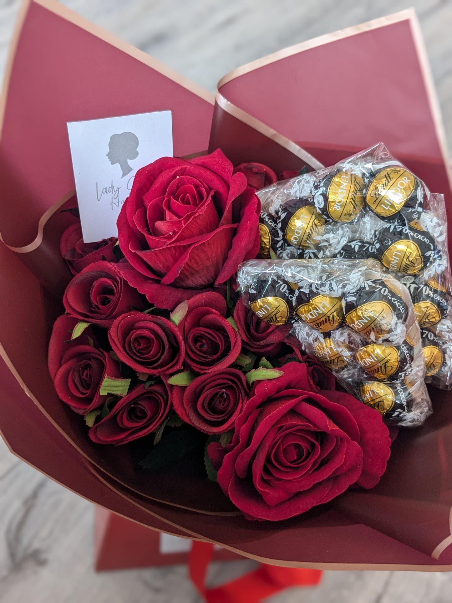 Red Dark Lindt Stunning Handtied Bouquet