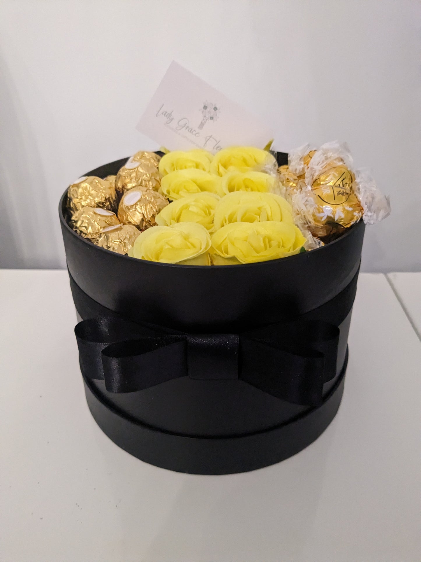 Black and Yellow Ferrero & White Lindt Hat Box Silk Flowers Gift - Medium