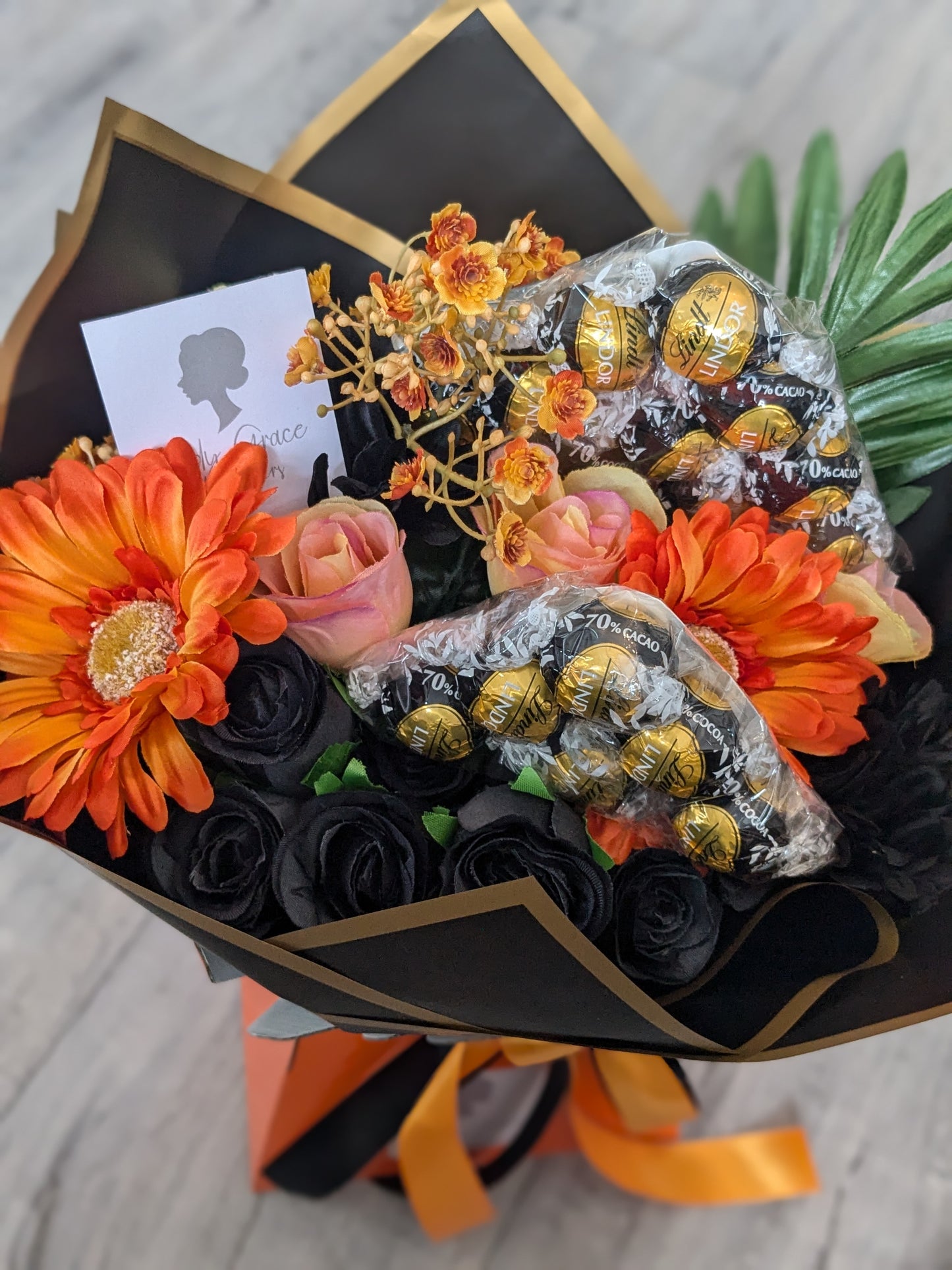 Orange & Black Dark Lindt Stunning Handtied Bouquet