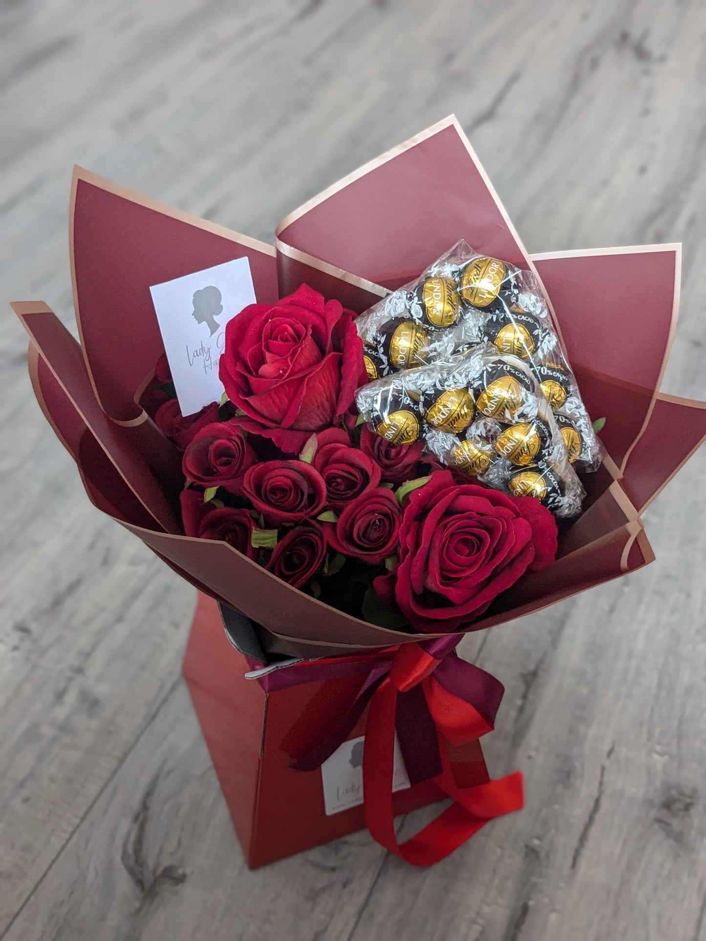 Red Dark Lindt Stunning Handtied Bouquet