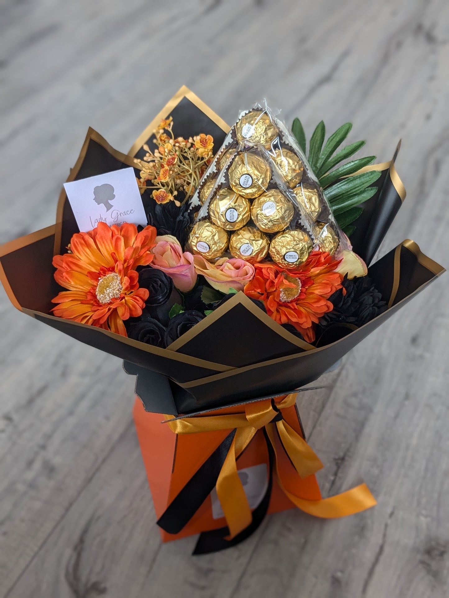 Orange & Black Ferrero Rocher Stunning Handtied Bouquet