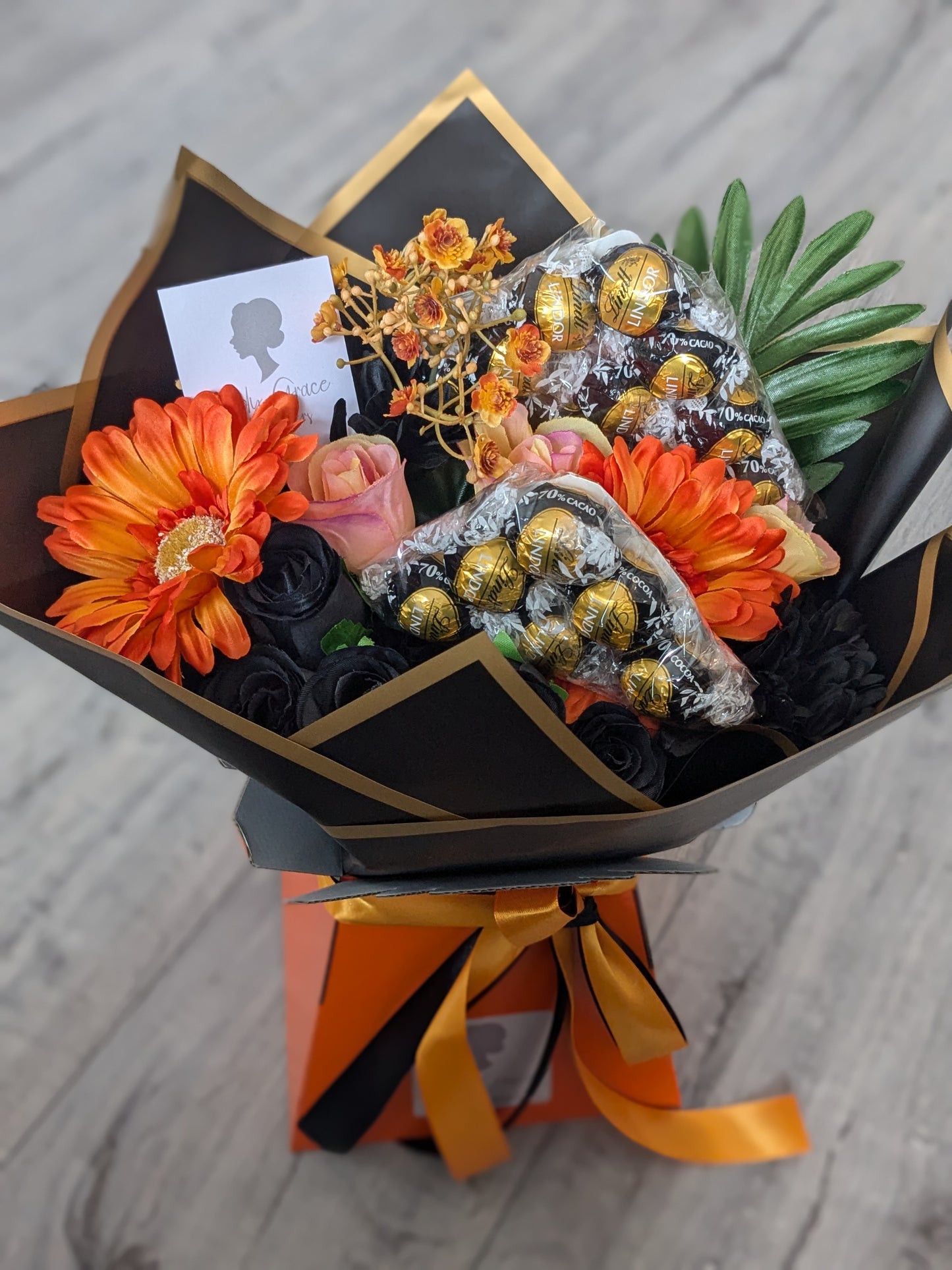 Orange & Black Dark Lindt Stunning Handtied Bouquet