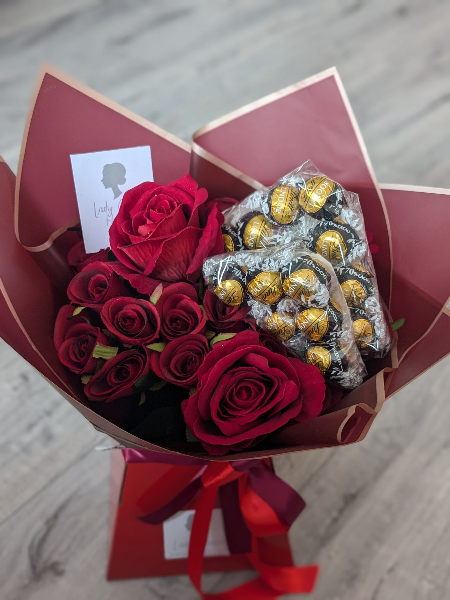 Red Dark Lindt Stunning Handtied Bouquet